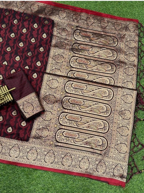 maroon banarasi style saree featuring woven design, zari border work, and a matching blouse piece